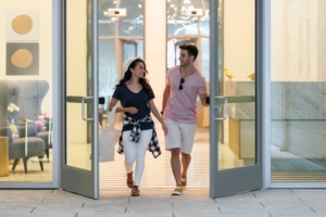 Couple exiting the front doors of The Beacon's lobby.