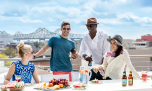 Downtown New Orleans Apartment Community With a Group Enjoying a Meal