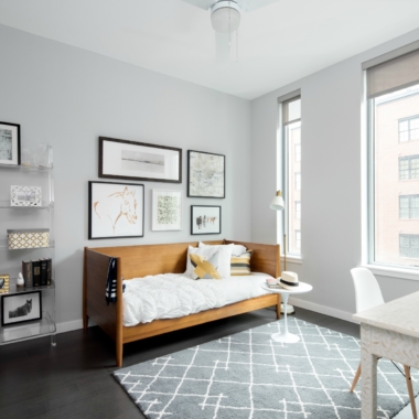 Guest room with a modern daybed and desk.