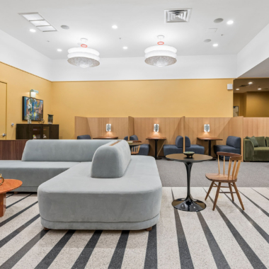 Lobby lounge with coworking space, featuring versatile seating and curated artwork