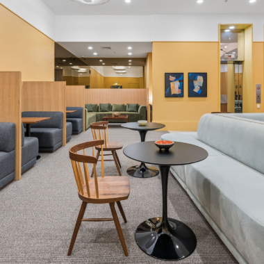 Lobby lounge with coworking space, featuring versatile seating and curated artwork