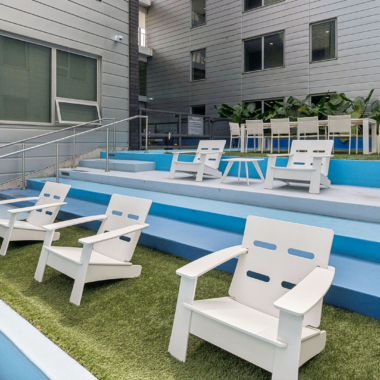 Stepped interior courtyard with lounge seating and landscaping